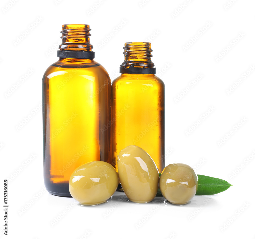 Glass bottles with olive oil on white background Glass bottles with olive oil on white background