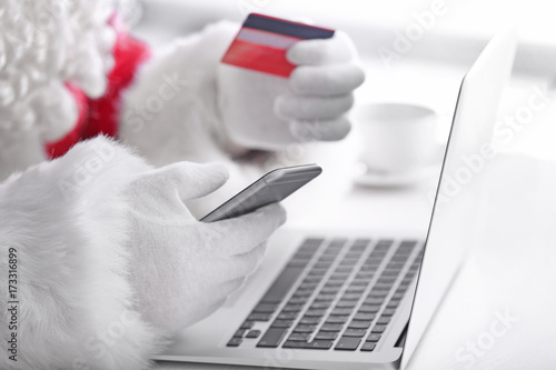 Santa Claus with phone, lap...