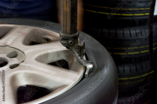 TYRE repairer repairing a tyre