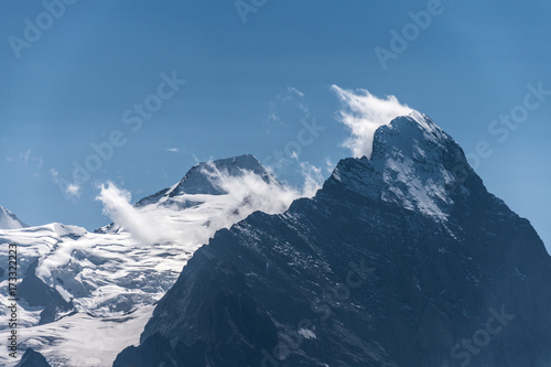 Closeup of Eiger in clouds  a peak in the Swiss Alps in Europe  with a part of Aletschglacier visible
