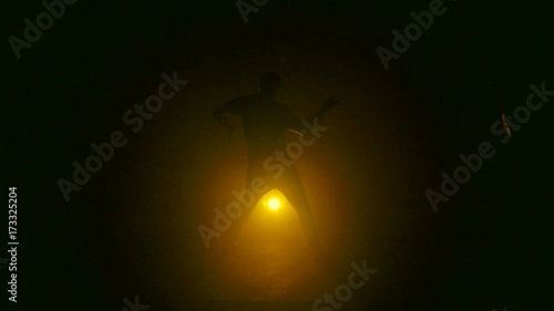 Silhouette dancing on yellow background