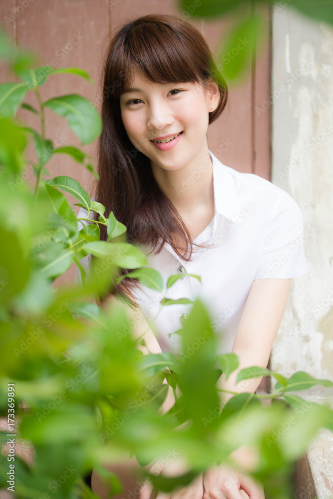 Portrait of thai adult student university uniform beautiful girl relax and smile Portrait of thai adult student university uniform beautiful girl relax and smile