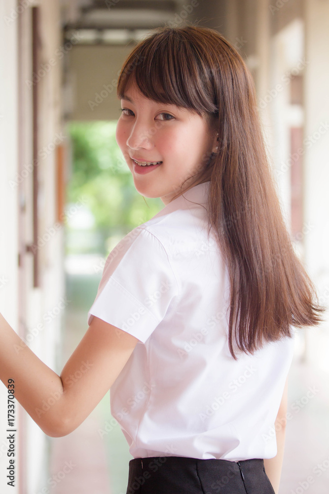 Portrait of thai adult student university uniform beautiful girl relax and smile Portrait of thai adult student university uniform beautiful girl relax and smile