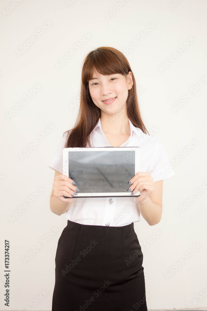 Portrait of thai adult student university uniform beautiful girl using her tablet. Portrait of thai adult student university uniform beautiful girl using her tablet.