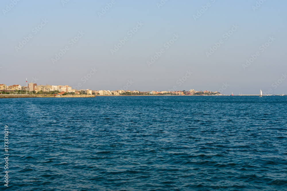 Evening seascape. Black Sea. The water area of the bay of the seaside town of Pomorie. Bulgaria.