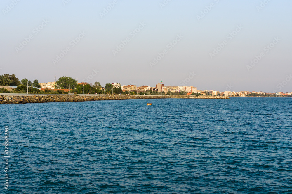 Evening seascape. Black Sea. The water area of the bay of the seaside town of Pomorie. Bulgaria. Evening seascape. Black Sea. The water area of the bay of the seaside town of Pomorie. Bulgaria.