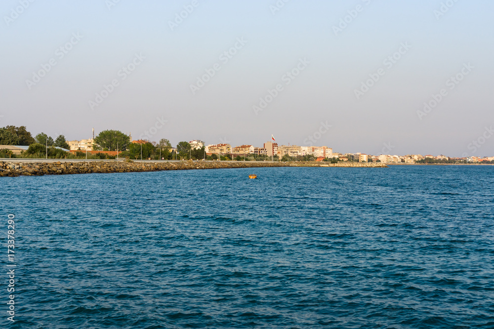 Evening seascape. Black Sea. The water area of the bay of the seaside town of Pomorie. Bulgaria.