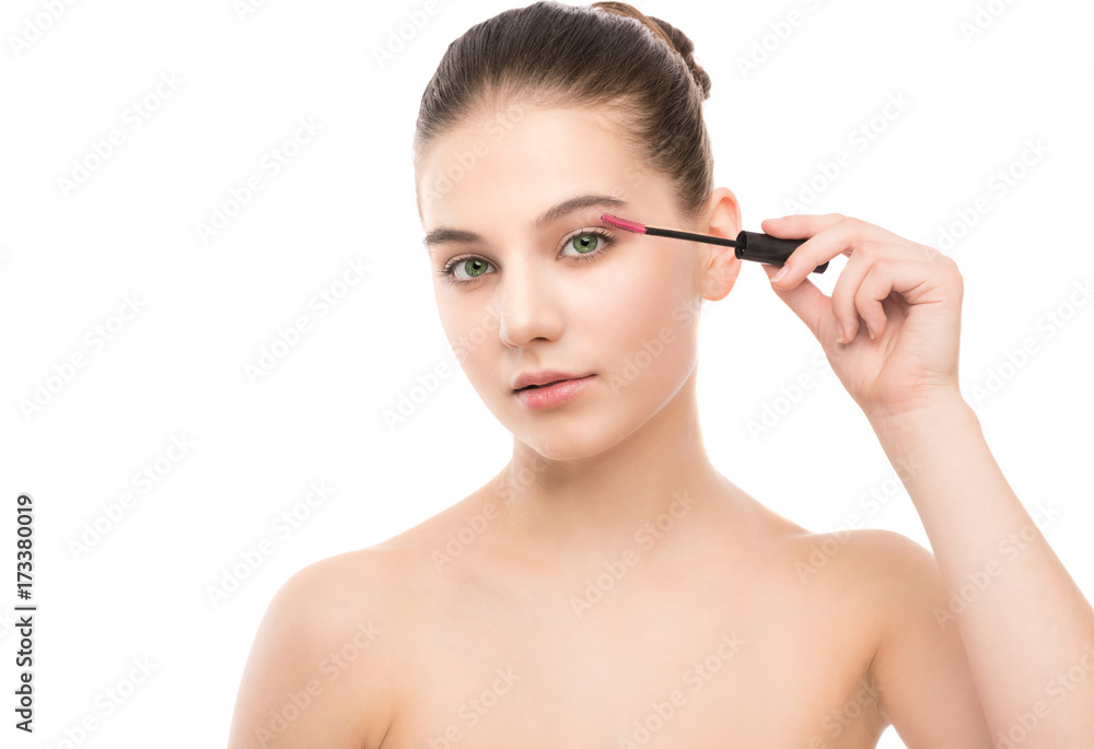 Eye make up apply. Mascara applying closeup, long lashes. Mascara brush. Portrait of beautiful young brunette woman with perfect fresh clean face skin. Eyelashes extensions. Make-up for green eyes Eye make up apply. Mascara applying closeup, long lashes. Mascara brush. Portrait of beautiful young brunette woman with perfect fresh clean face skin. Eyelashes extensions. Make-up for green eyes
