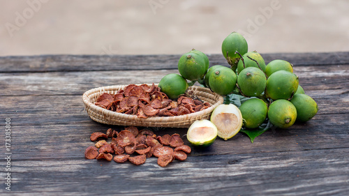 Photography fresh betel nut with betel leaf isolated on the wood background