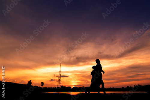 Silhouette of people  jogging for exercise in park at sunset,Silhouette  sporty image concept.