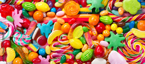 Various colorful candies, jellies, lollipops and marmalade