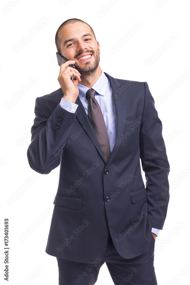 Cheerful businessman talking on the phone, isolated on a white background Cheerful businessman talking on the phone, isolated on a white background