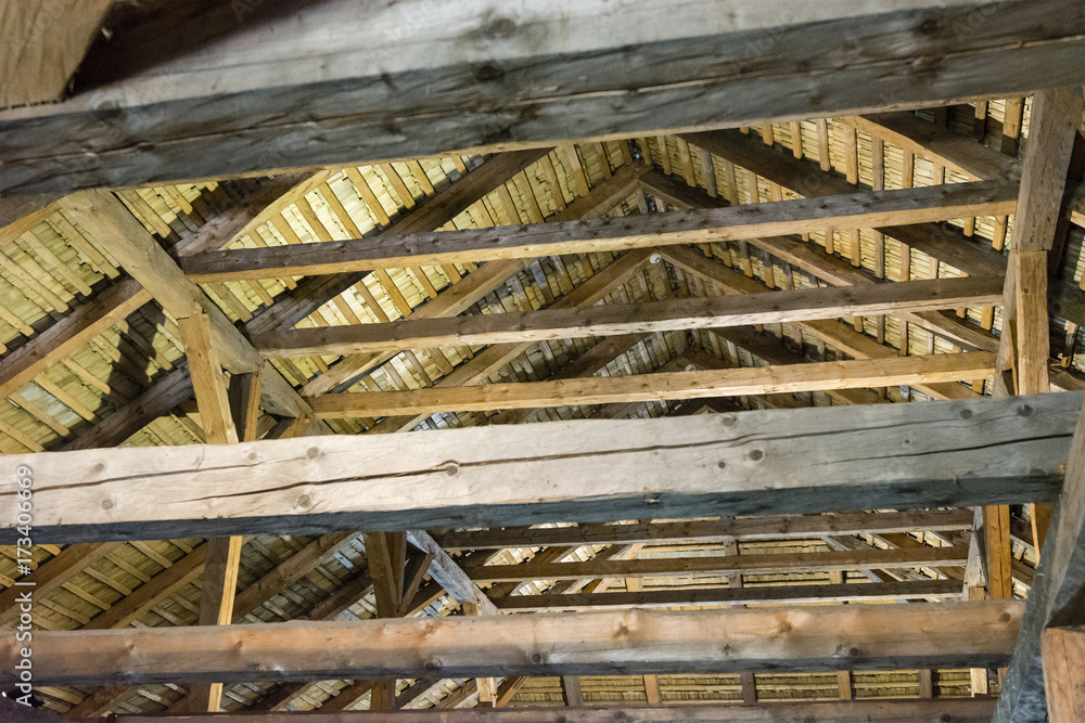 The inner part of the barn with beams and roof.