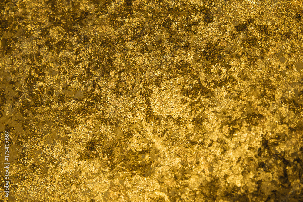 Golden pieces and sequins textured background
