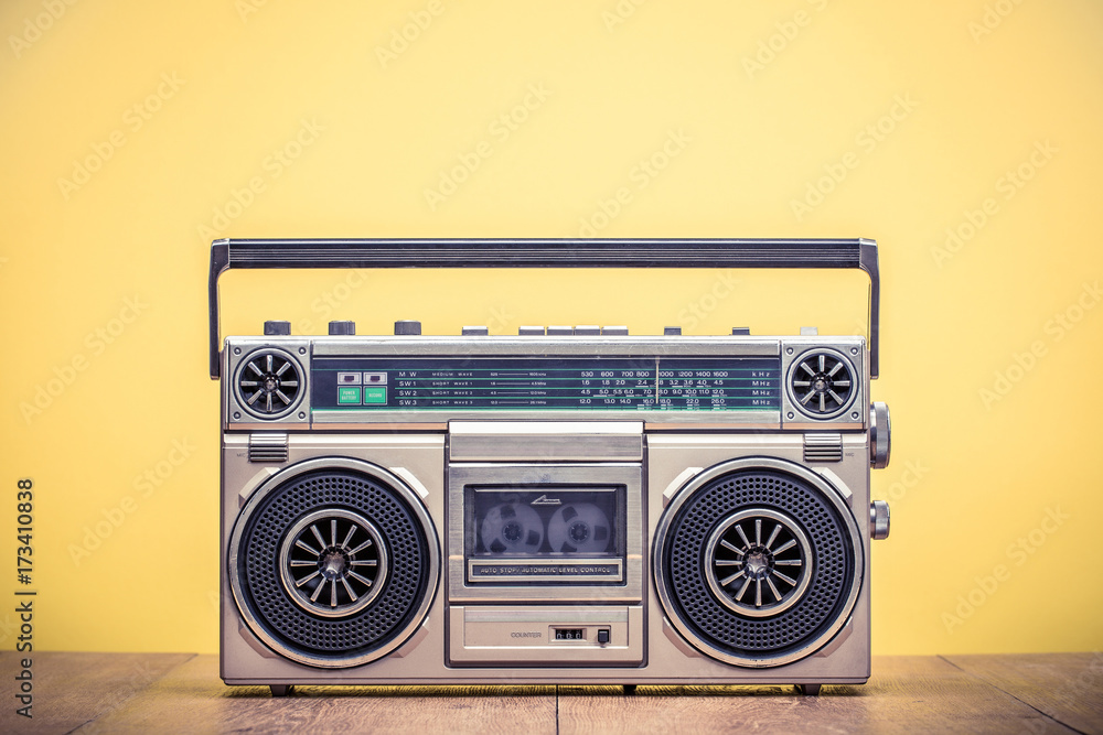 Retro outdated portable stereo boombox radio cassette recorder from 80s  front yellow background. Vintage instagram old style filtered photo foto de  Stock | Adobe Stock