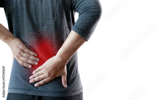 young man Feeling suffering Lower back pain Pain relief concept