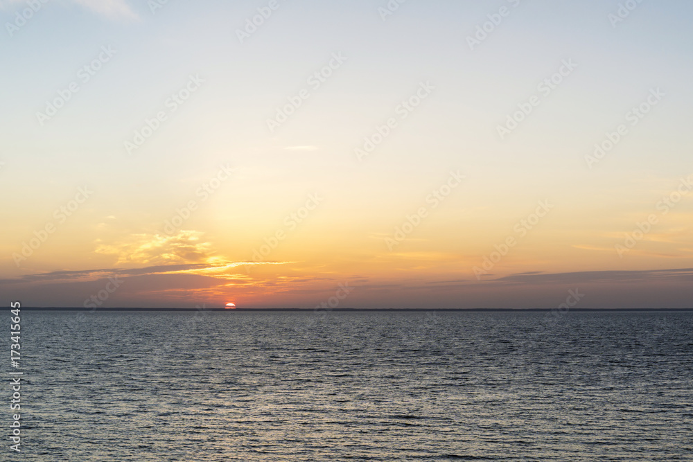 Sunrise behind the sea horizon