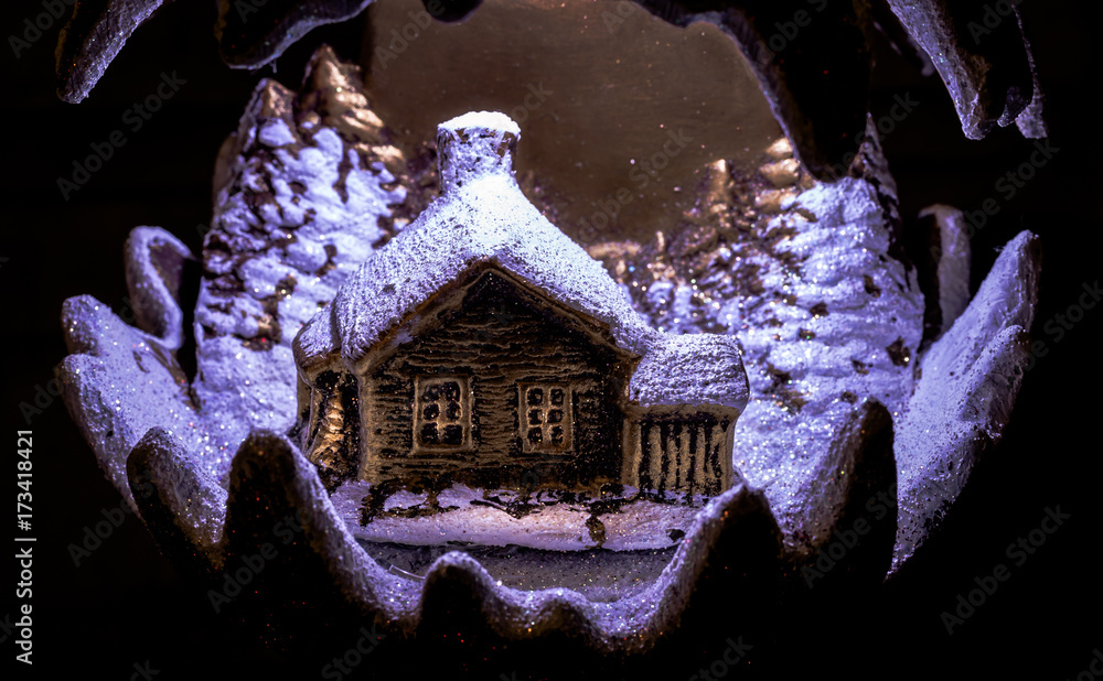 Obraz premium Handmade illuminated ceramics house and winter scene with Christmas trees