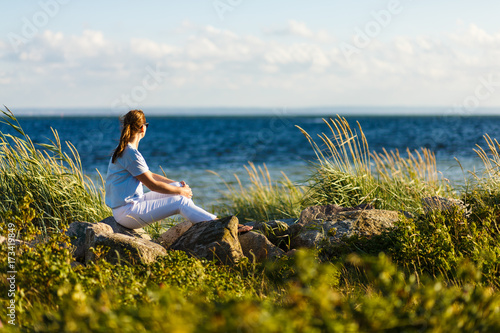 Woman relaxing at seaside 