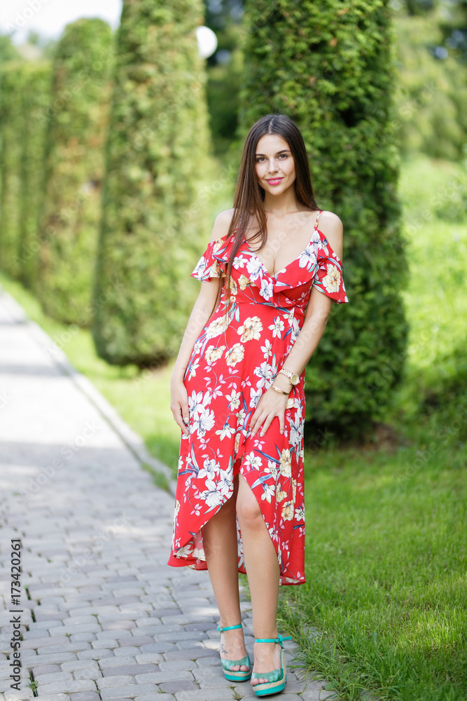 Outdoors portrait of beautiful brunette girl looking at camera Outdoors portrait of beautiful brunette girl looking at camera
