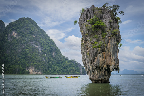 Limestone rocks of James Bond Island, and calm sea, Phuket, Thailand. Ko Ta Pu is a 20 metres limestone rock, northeast of Phuket, featured in a James Bond movie. photo