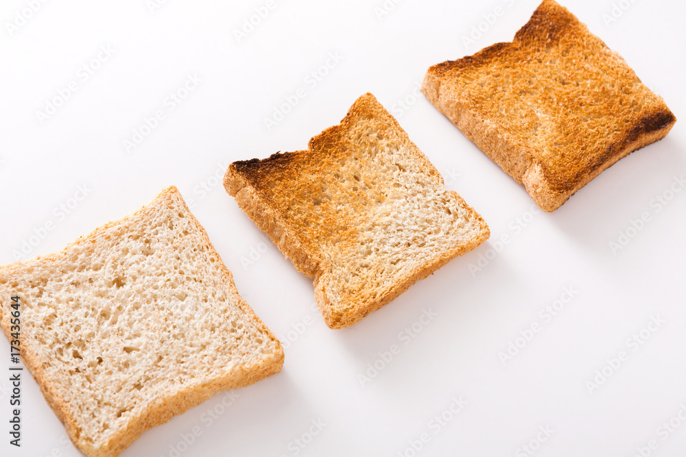 Toasted bread slices isolated at white background Toasted bread slices isolated at white background