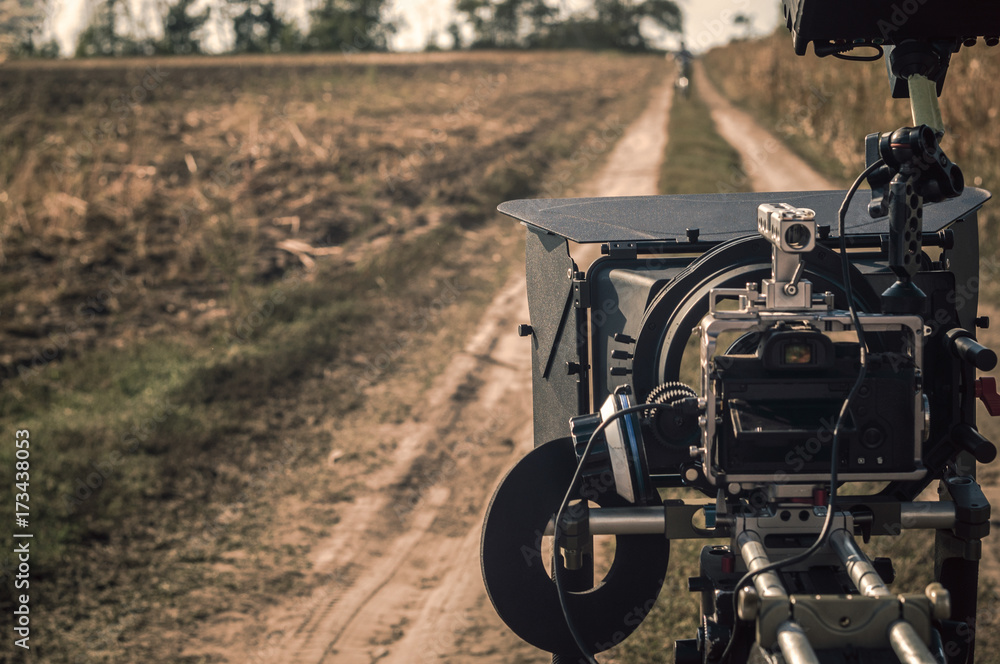 Naklejka premium Compact professional mirrorless filming camera rig outdoors in production