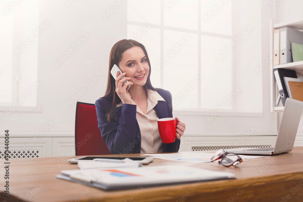 Business talk, woman consulting by phone at office Business talk, woman consulting by phone at office