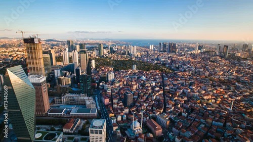 Zoom out timelapse rooftop view of Istanbul business district and Golden horn photo