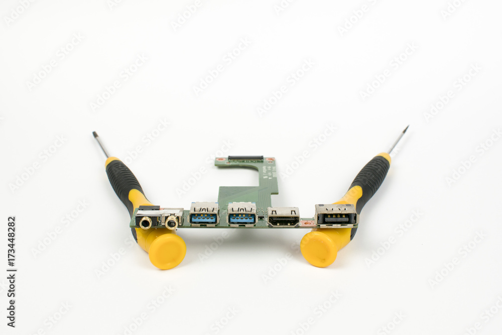 Two screwdrivers, usb out board on a white background Two screwdrivers, usb out board on a white background