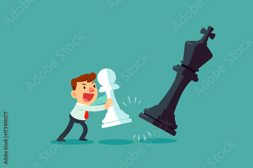 businessman moving chess pawn versus the king chess piece