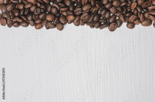 Frame of coffee beans with free space for text, white background top view © Maksim