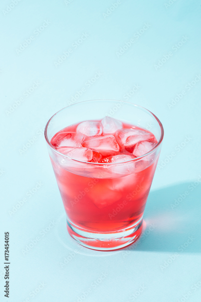 Sparkling red color drinks with water soda and ice in glass Sparkling red color drinks with water soda and ice in glass