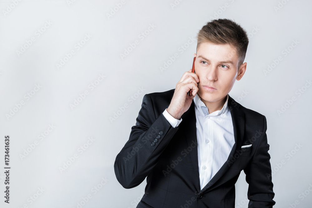 Business man in suit talking on the phone Business man in suit talking on the phone