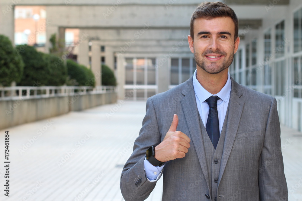 Businessman showing a double thumbs up Businessman showing a double thumbs up