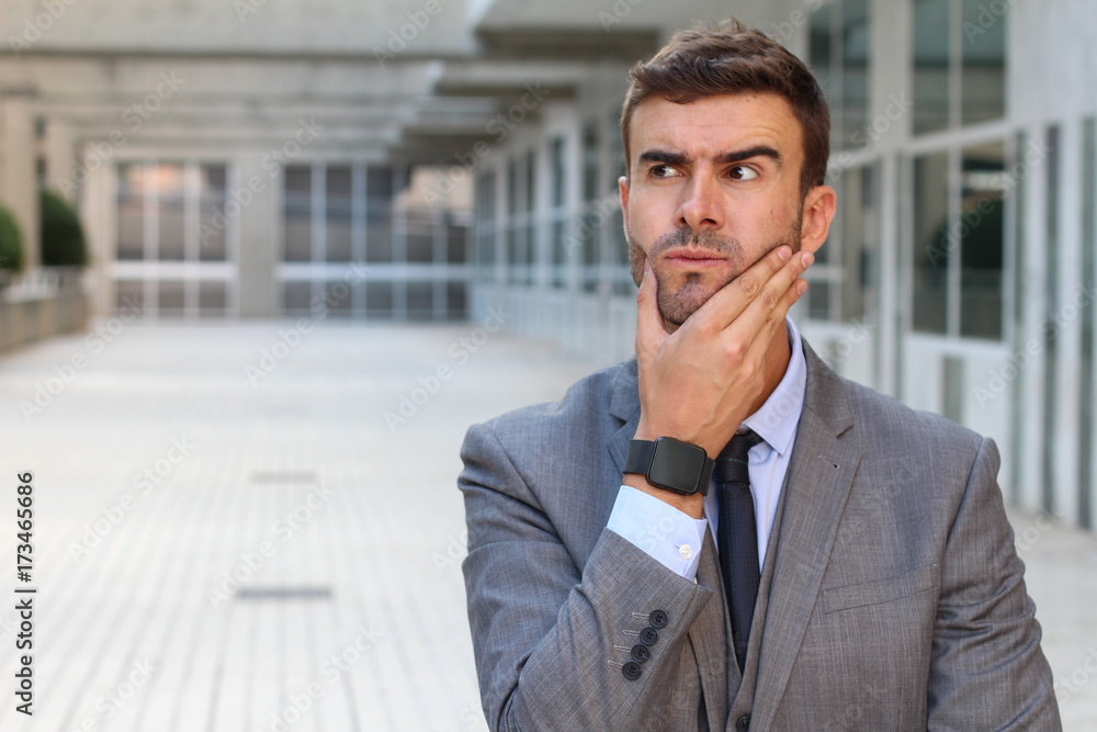 Funny businessman thinking really hard with space for copy Funny businessman thinking really hard with space for copy