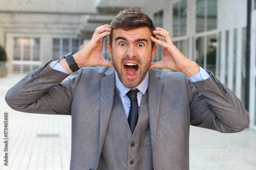 Businessman showing hysteria close up with copy space