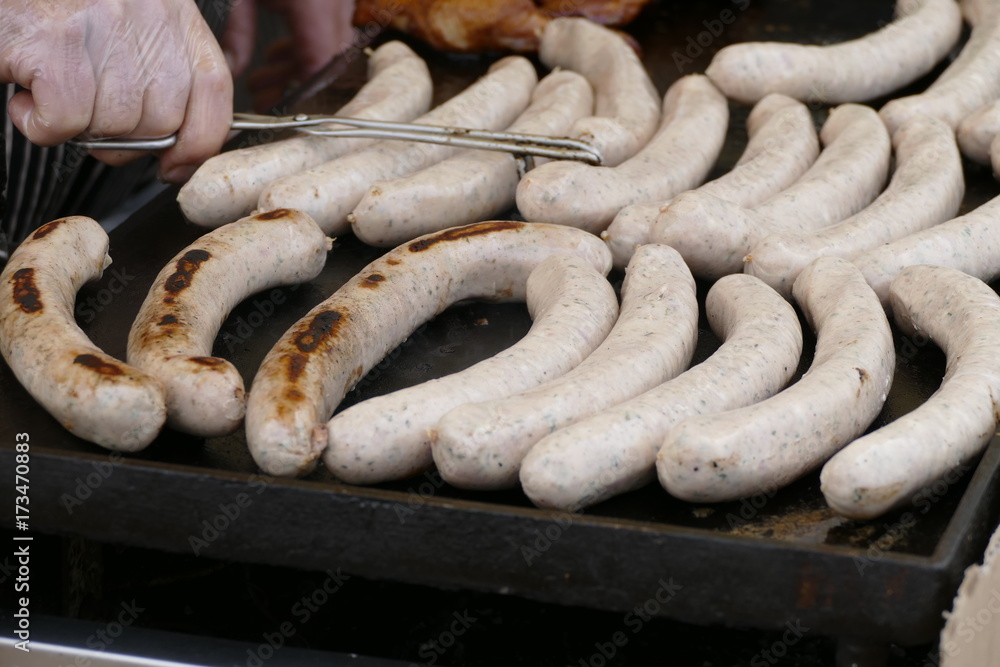 white sausages on a grill