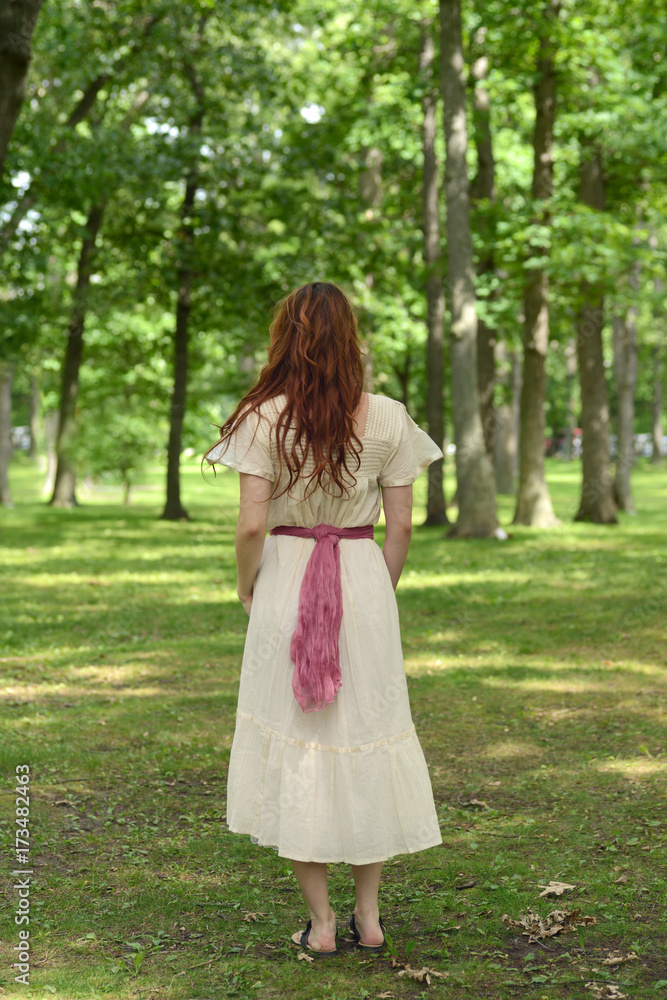back of vintage woman in park