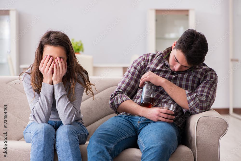 Drinking problem drunk husband man in a young family concept Drinking problem drunk husband man in a young family concept