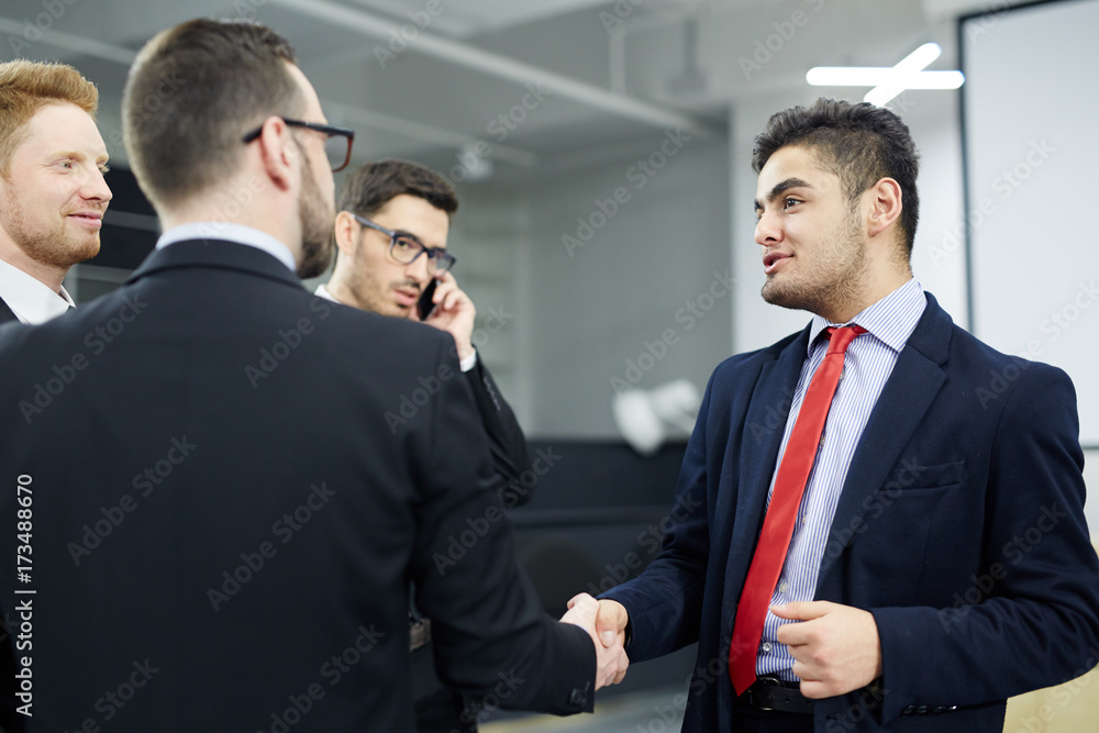 Fototapeta premium Successful politicians greeting one another by handshake after meeting