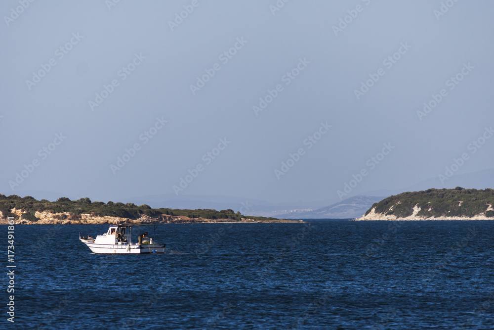 Fishing boat on the blue turkish aegean sea