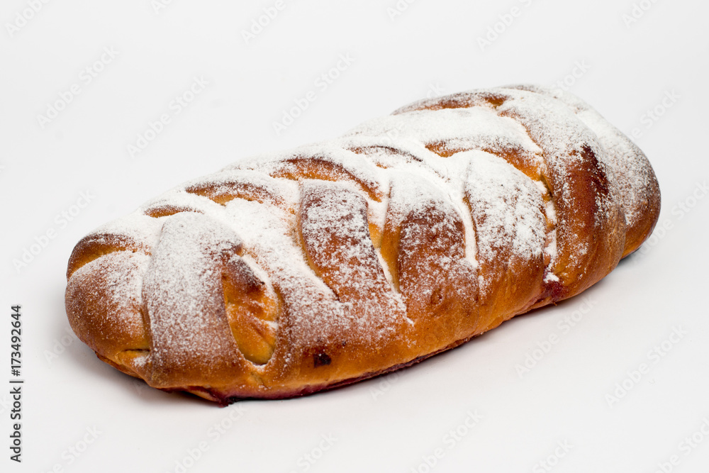 Sweet cinnamon bun roll swirl isolated over the white background Sweet cinnamon bun roll swirl isolated over the white background