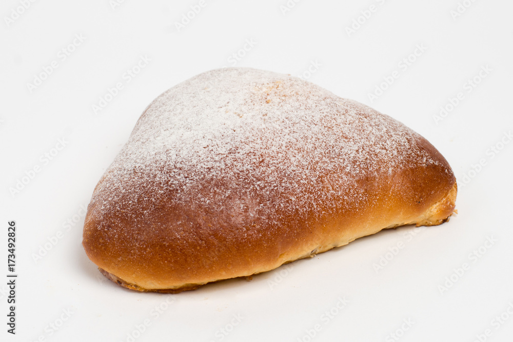 Sweet cinnamon bun roll swirl isolated over the white background Sweet cinnamon bun roll swirl isolated over the white background