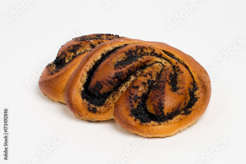 Sweet cinnamon bun roll swirl isolated over the white background