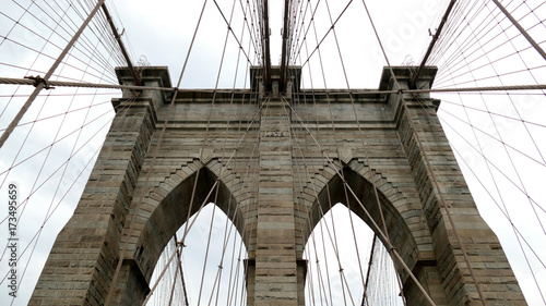 Brooklyn bridge detail in New York City - stone and cable