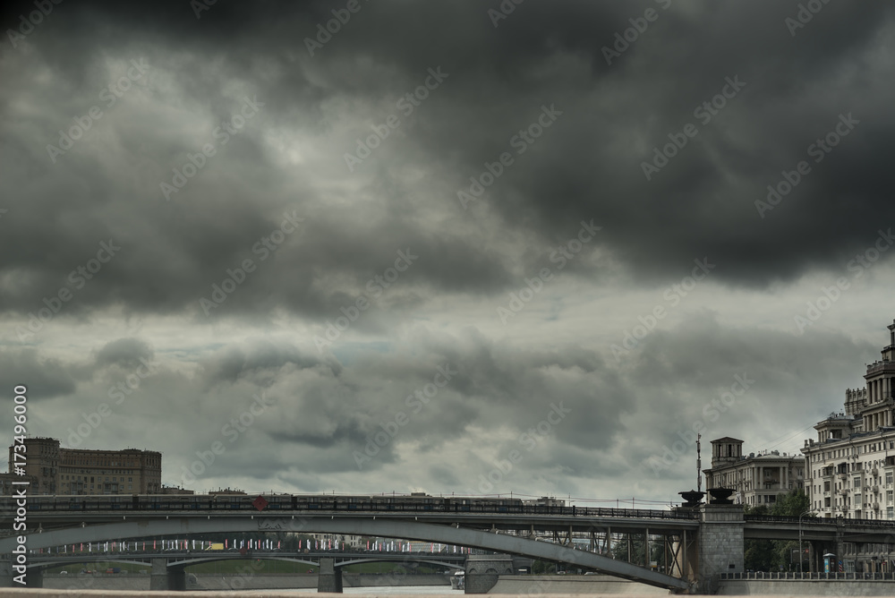 Black clouds above Moscow river bridge. Russia Black clouds above Moscow river bridge. Russia