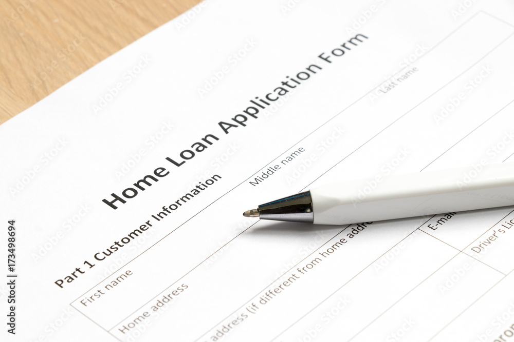 Home loan application form with pen on desk background Home loan application form with pen on desk background