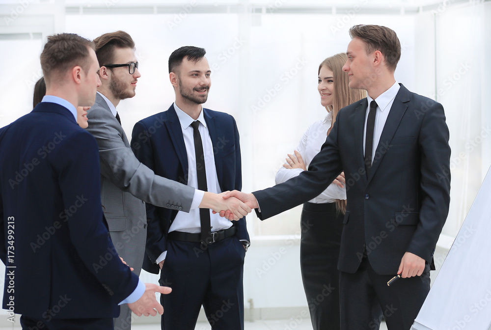 handshake Manager and the client in the office handshake Manager and the client in the office