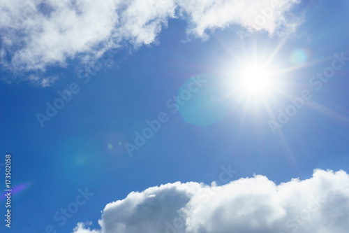 blue sky with clouds and sun for background. sun light shining over the clear sky and clouds. Beautiful and Amazing azure sky with clouds and sunshine for background